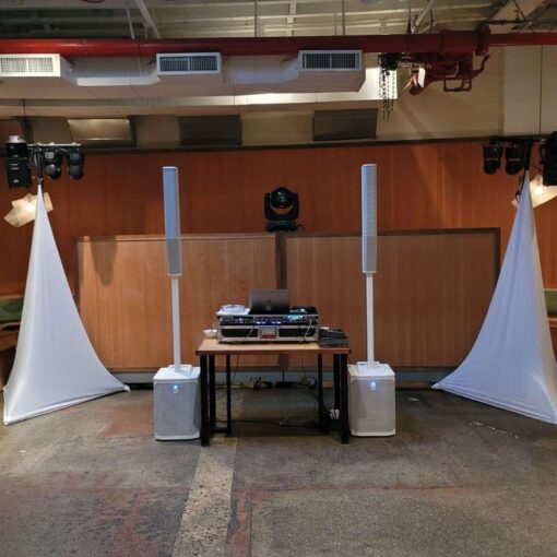 Intelligent Lighting for the dance floor at a wedding at Rule of Thirds in Brooklyn, NY, featuring scanners and mini moving head wash lighting fixtures hanging from a pair of lighting stands covered with decorative white spandex.