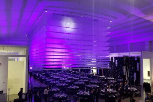A lavender wash of light projected on the ceiling for a wedding at The Queens Museum in Queens, NY.