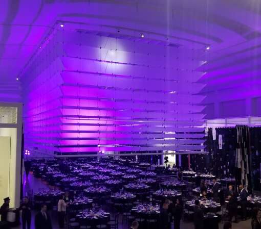 A lavender wash of light projected on the ceiling for a wedding at The Queens Museum in Queens, NY.