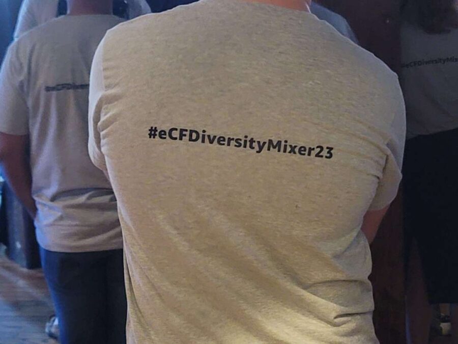 Gray Amazon t-shirt with #eCFDiversityMixer23 hastage for an eCF event hosted by Amazon at The Dumbo Loft in Brooklyn, NY.