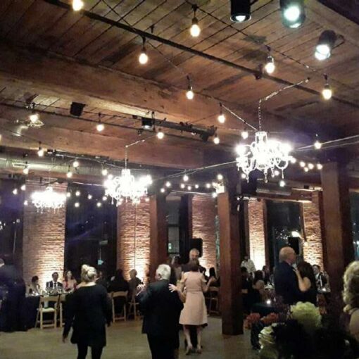 24" Chrystal Chandeliers with String Lights and Up-Lights at The Dumbo Loft.