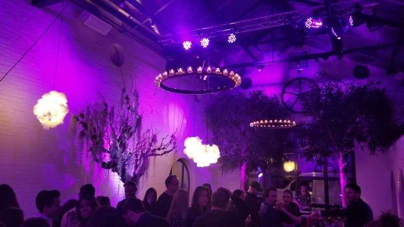 The Albra Room at The Foundry: Circular Chandeliers w/ votive candles and a color-changing wash projected against the upper walls.