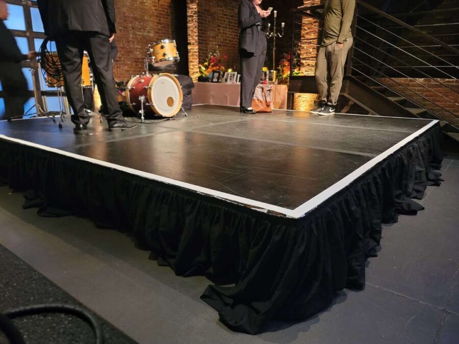 A 12ft x 12ft stage in the main room under the mezzanine level near the entrance doors at The Foundry.
