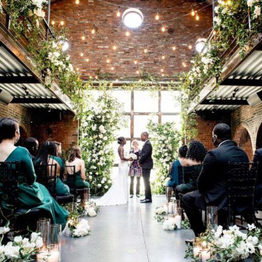 String Lights with warm white bulbs suspended in the main room for a micro wedding at The Foundry.