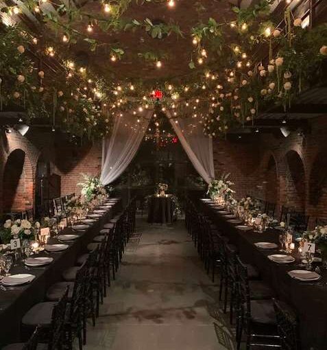 String Lights with warm white bulbs and Ivy hanging overhead from our String Lights in the Main Room at The Foundry.
