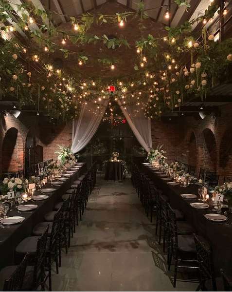 String Lights with warm white bulbs and Ivy hanging overhead from our String Lights in the Main Room at The Foundry.