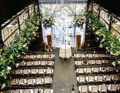 String Lights with warm white bulbs and Ivy hanging overhead in the Main Room at The Foundry.