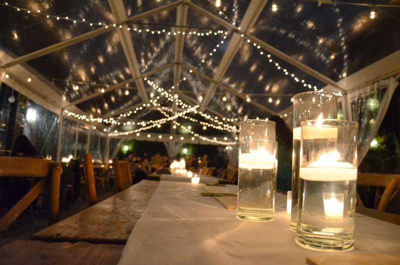 String Lights with Twinkle Lights hanging under a clear top tent for a wedding at The Foundry.
