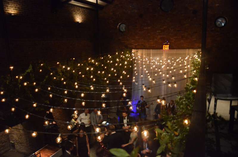 A zigzagging canopy of string lights hanging in the main room at The Foundry.