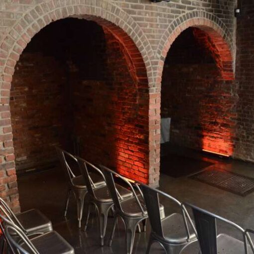 Amber LED Bars inside each alcove in the main room for a wedding at The Foundry.