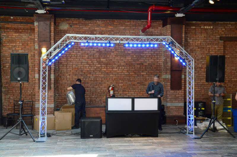 An Arch DJ Truss with Multiple LED lights and lighting controller for a wedding at 26 Bridge. 