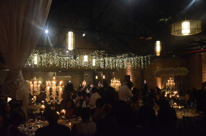 Icicle Lights / Fairy Lights hanging between the 3rd and 4th beam in the main room for a wedding at 26 Bridge.