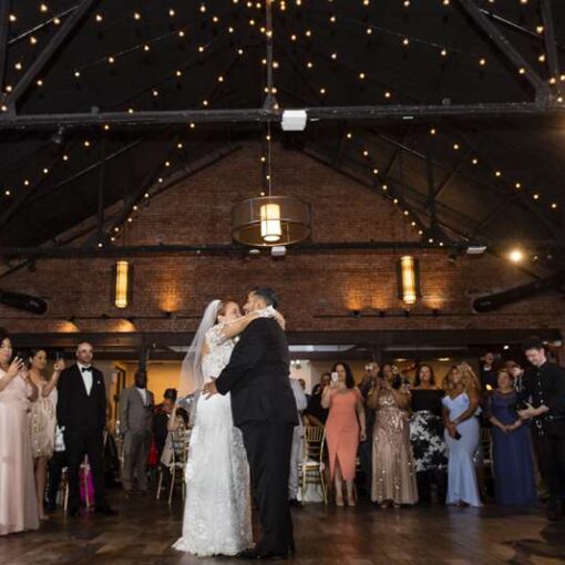 Warm White String Lights hanging in a circular pattern at a wedding at 26 Bridge (Brooklyn, NY)