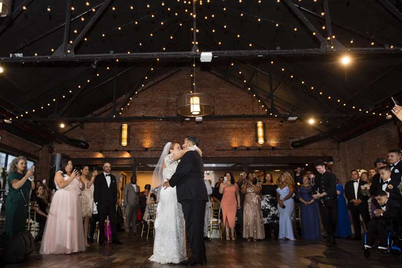 Warm White String Lights hanging in a circular pattern at a wedding at 26 Bridge (Brooklyn, NY)
