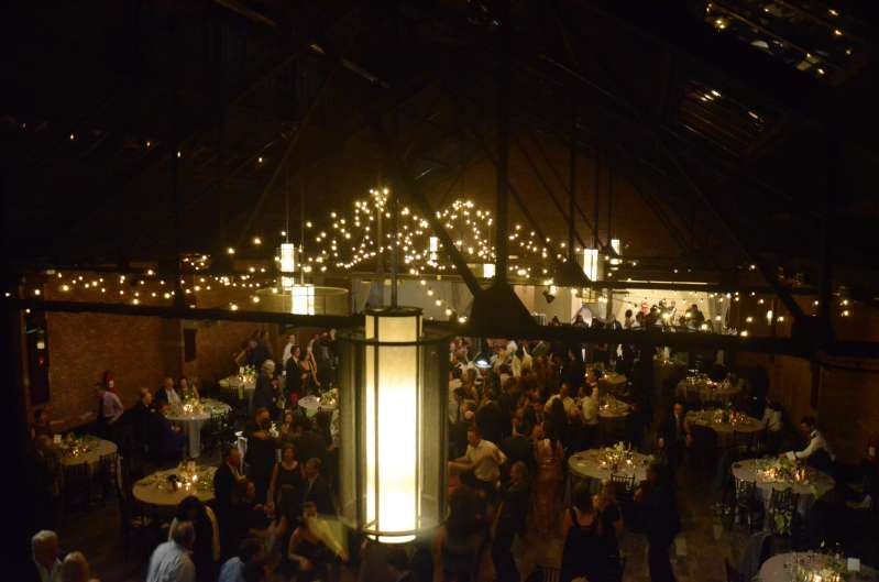 Warm White String Lights hanging in a two circular patterns for a wedding at 26 Bridge (Brooklyn, NY)