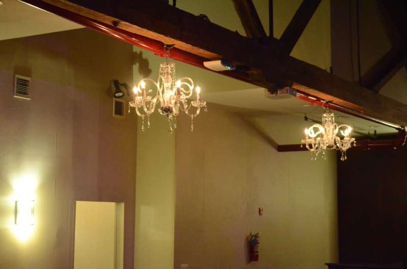 chandeliers hanging in the rear bar area.