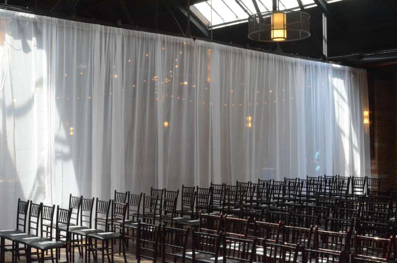 White Sheer Curtains hanging across the main room at 26 Bridge.