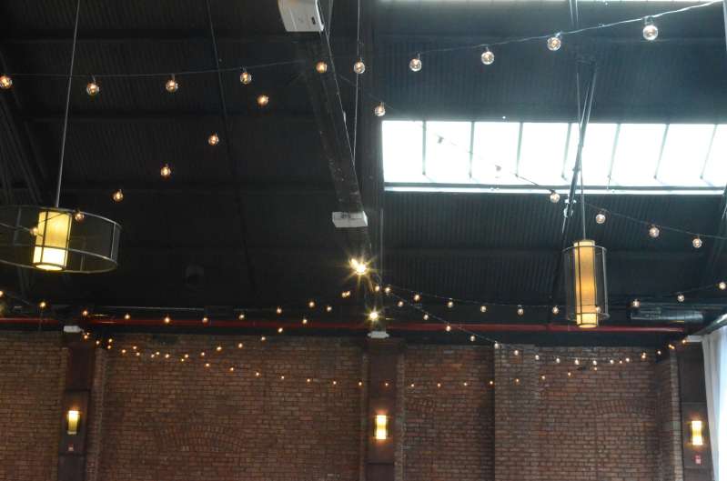 String Lights with S14 Bulbs hanging in a zigzag pattern for a wedding at 26 Bridge. 