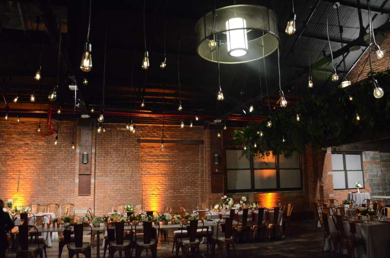 Pendant Lamps with Vintage Style Antique Edison Bulbs hanging over the dance floor at 26 Bridge.  Amber Up-Lights around the perimeter of the main room at 26 Bridge.