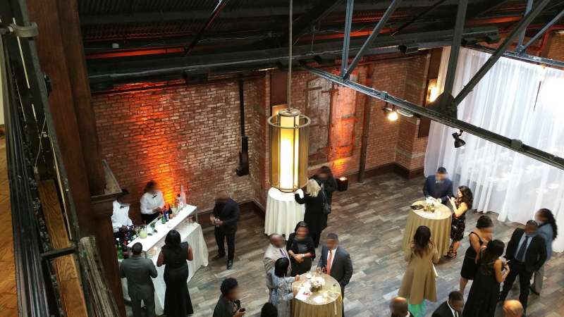 Sandra Marcelin and Mcduff Goldman wedding on Saturday, October 17, 2015 at 26 Bridge. Amber Up-Lights around the perimeter wall of the main space.