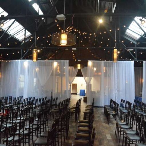 Warm White String Lights hanging in a circular pattern for a wedding at 26 Bridge (Brooklyn, NY)