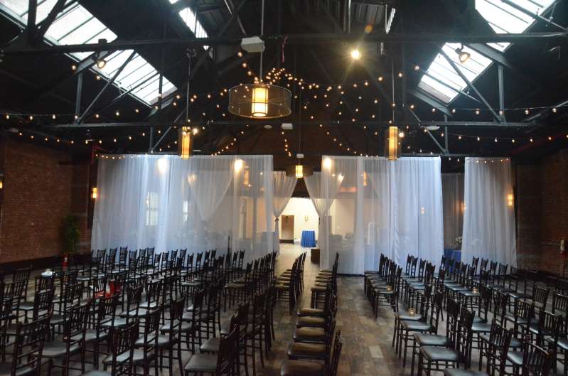 Warm White String Lights hanging in a circular pattern for a wedding at 26 Bridge (Brooklyn, NY)