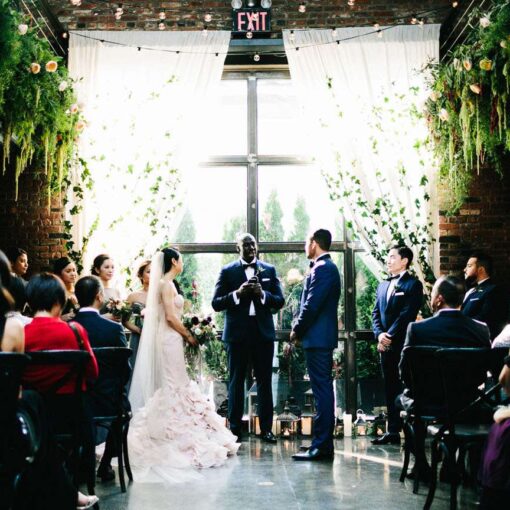 Warm White zigzagging string lights hanging in the main room for Diana and Carlos's wedding at The Foundry.