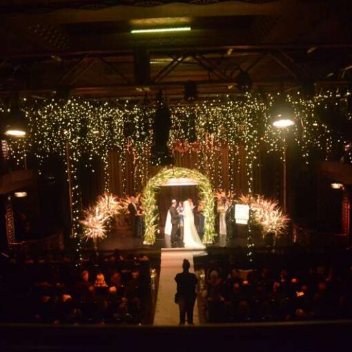 Warm White Fairy (Icicle) Lights hanging above the main floor for a wedding at The Edison Ballroom.
