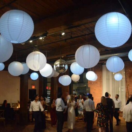 Paper Lanterns with decorative LED lights hanging in the main room for a wedding at The Dumbo Loft.