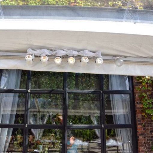 Pin-Spots hanging under a clear-top tent in The Courtyard for a wedding at The Foundry.
