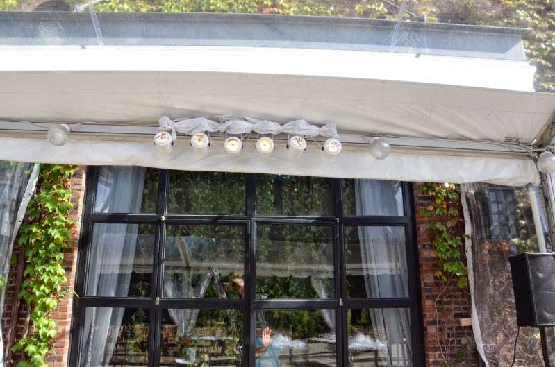 Pin-Spots hanging under a clear-top tent in The Courtyard for a wedding at The Foundry.
