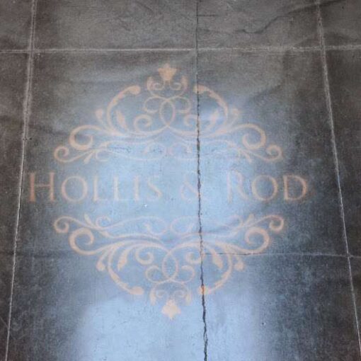 A custom gobo is projected on the main room's floor for a wedding at The Foundry.