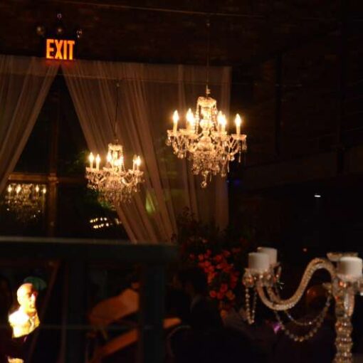 Crystal Chandeliers hanging in the main room for a wedding at The Foundry.