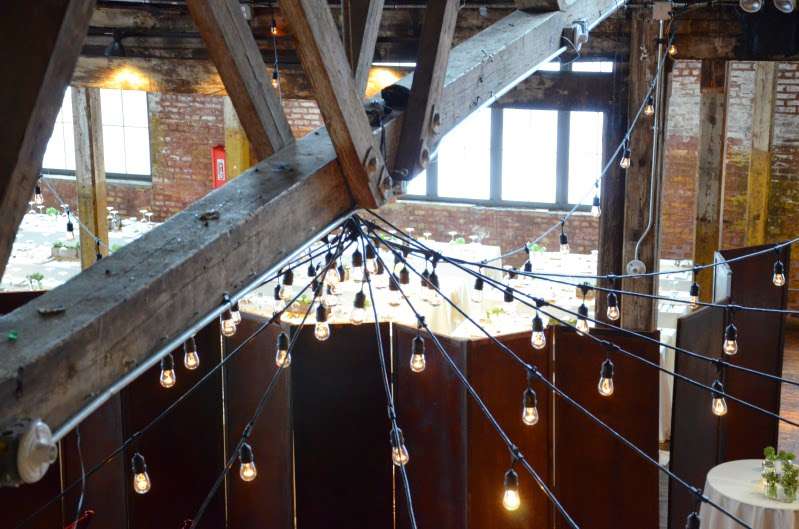 String Lights hanging in a circular pattern between the center columns at The Greenpoint Loft