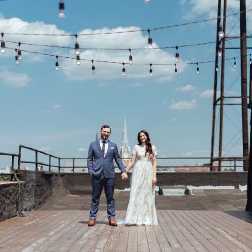 Warm White String Lights are hanging above the rooftop terrace for a wedding at The Greenpoint Loft.