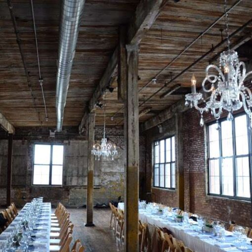 A chandelier under the lower ceiling area on the main floor at The Greenpoint Loft.