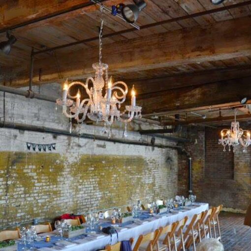Chandeliers under the lower ceiling area on the main floor at The Greenpoint Loft.