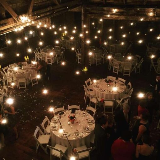 String Lights hanging overhead in a V-shaped pattern for a wedding at The Greenpoint Loft.