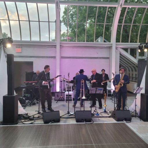 Moving color changing lights for the dance floor at a wedding in The Palm House in The Brooklyn Botanical Garden.