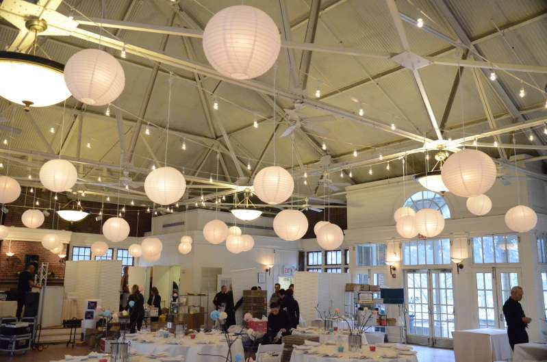 A combination of String Lights and 40 Paper Lanterns hanging in the main room at The Prospect Park Picnic House.
