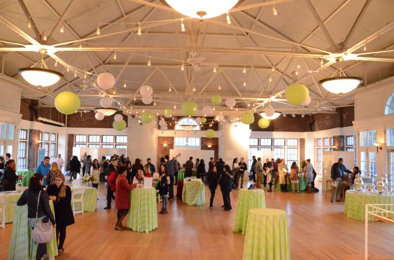 Approximately 25 Lime Green and White Paper Lanterns hanging from zigzagging string lights in The Prospect Park Picnic House.