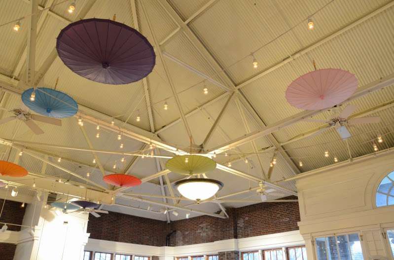 250ft of String Lights and 15 Paper Parasols / Paper Umbrellas hanging inside The Prospect Park Picnic House.