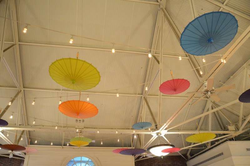String Lights (Bistro Lights/Cafe Lights) with Paper Umbrellas in various sizes, colors, and heights at the Prospect Park Picnic House.