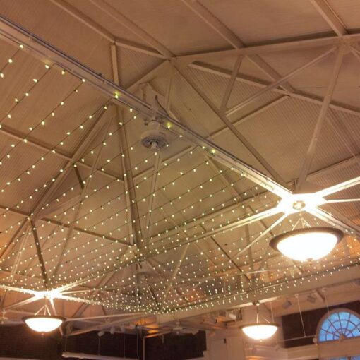 A canopy of Twinkle Lights hanging over the main floor for a wedding at The Prospect Park Picnic House.