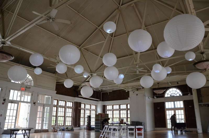 Paper Lanterns hanging inside The Prospect Park Picnic House for a wedding.