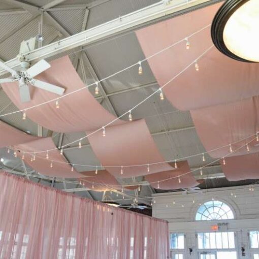 Drapes and String Lights hanging from the ceiling at Prospect Park Picnic House.