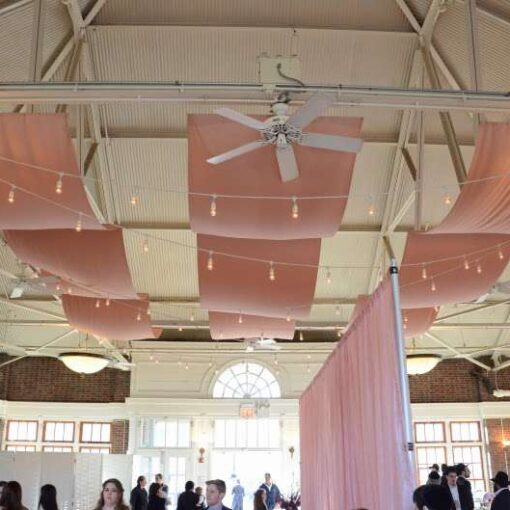 Drapes and String Lights hanging from the ceiling at Prospect Park Picnic House.