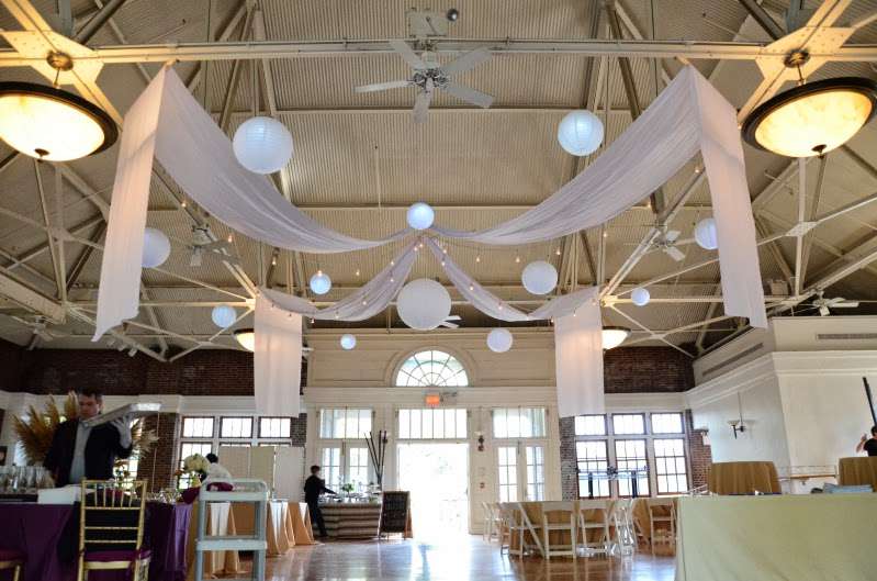 Paper Lanterns hanging with String Lights (Cafe Lights/ Bistro Lights) and white drapes at The Prospect Park Picnic House.