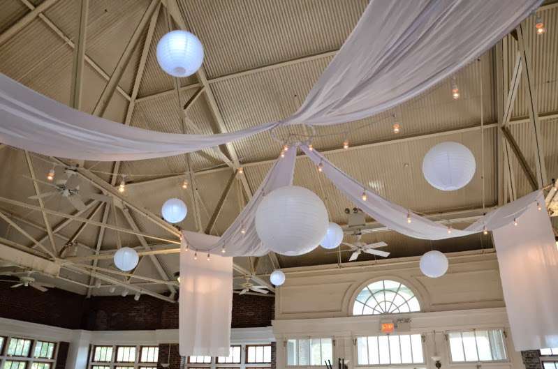 Paper Lanterns hanging with String Lights (Cafe Lights/ Bistro Lights) and white drapes at The Prospect Park Picnic House.