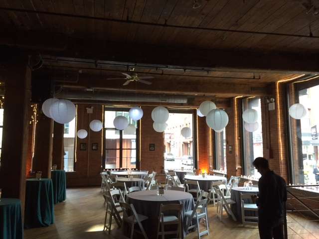 Paper Lanterns hanging on the sides of the main room at The Dumbo Loft.
